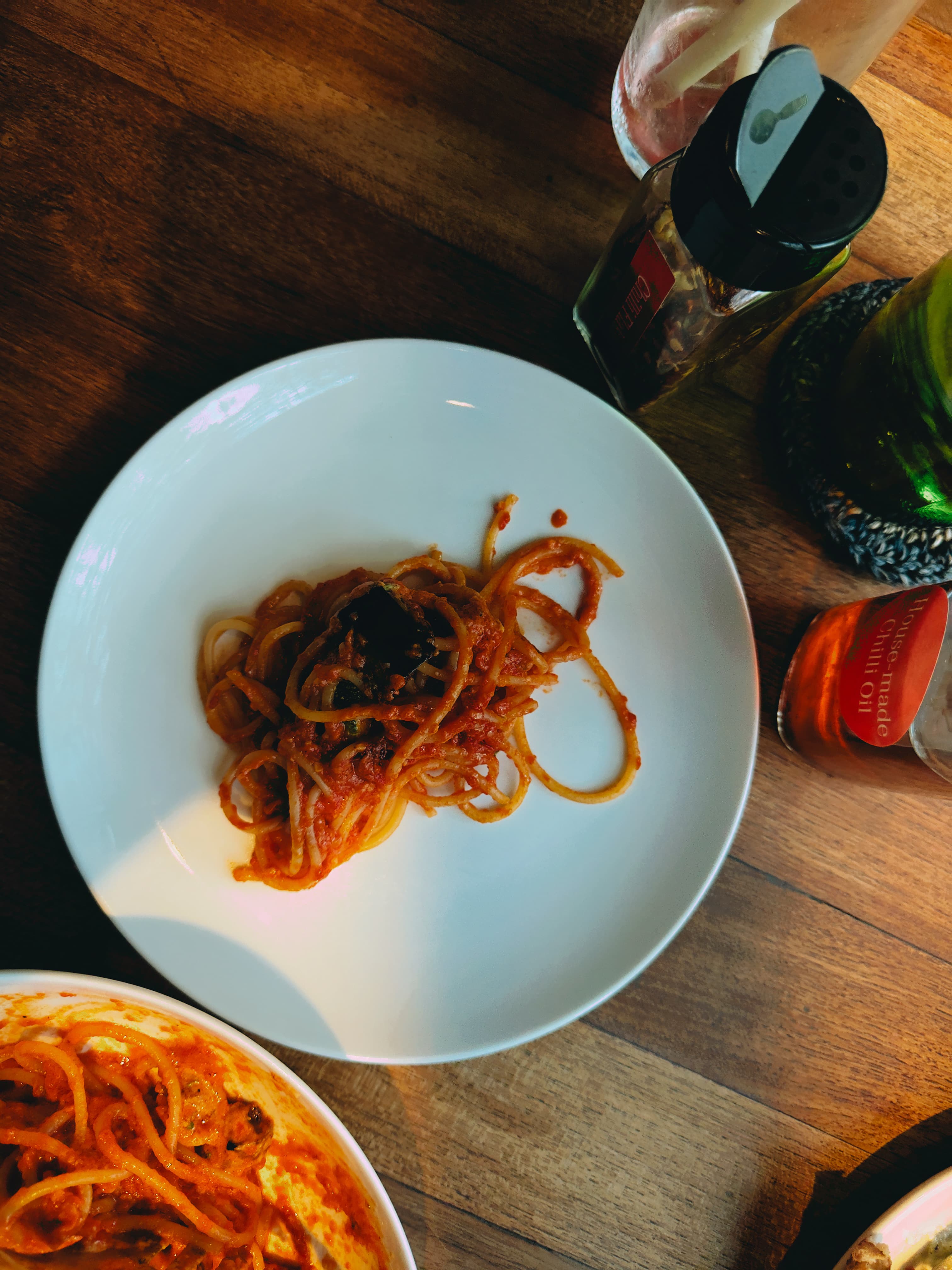 Spaghetti in tomato sauce on a white plate